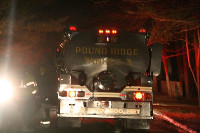 Dee Duffield standing with T3 at the Wallenberg Dr. fire in Stamford on Christmas night 2010.